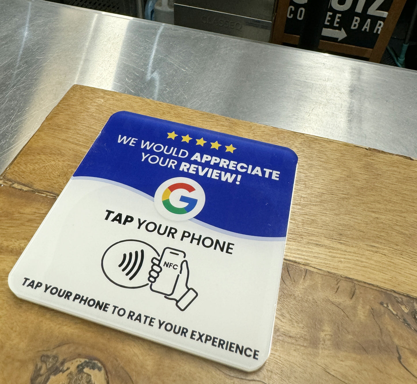ReviewBoost NFC Plaque on a Cafes Counter for Google Reviews